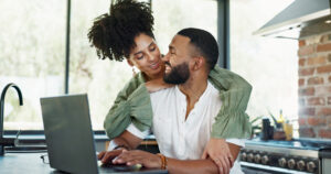laptop-relax-and-couple-hug-in-home-for-bonding-2025-04-06-10-00-13-utc